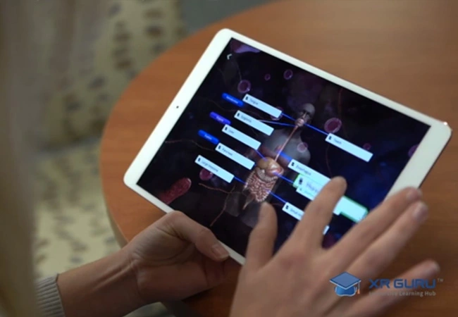 Boy wearing a virtual reality headset and looking at Human Anatomy